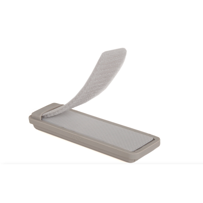 Underside of grey MagPad showing white magnetic surface and fold-over velcro strap