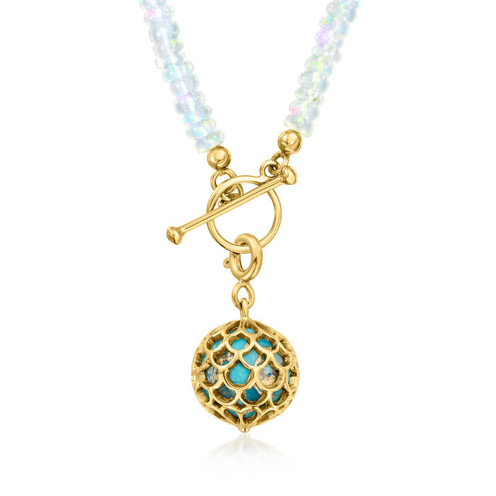 Turquoise scales charm with gold loop clasp and teal stone center.